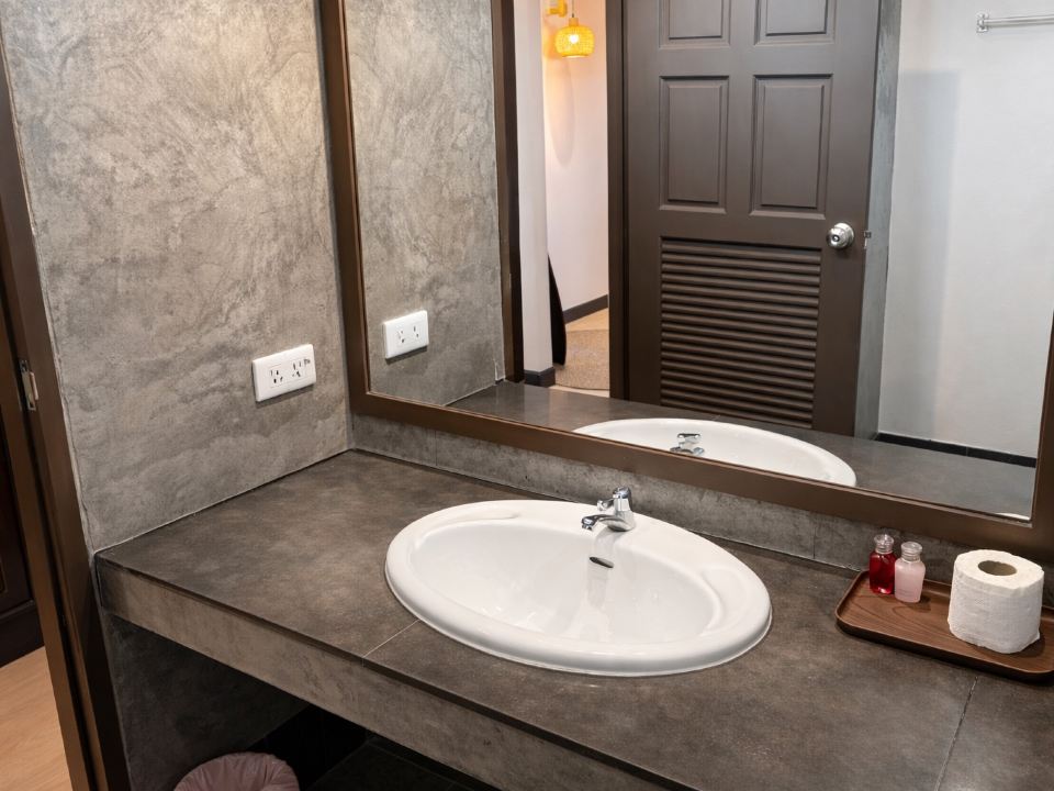 AKIRA Resort bathroom with oval sink