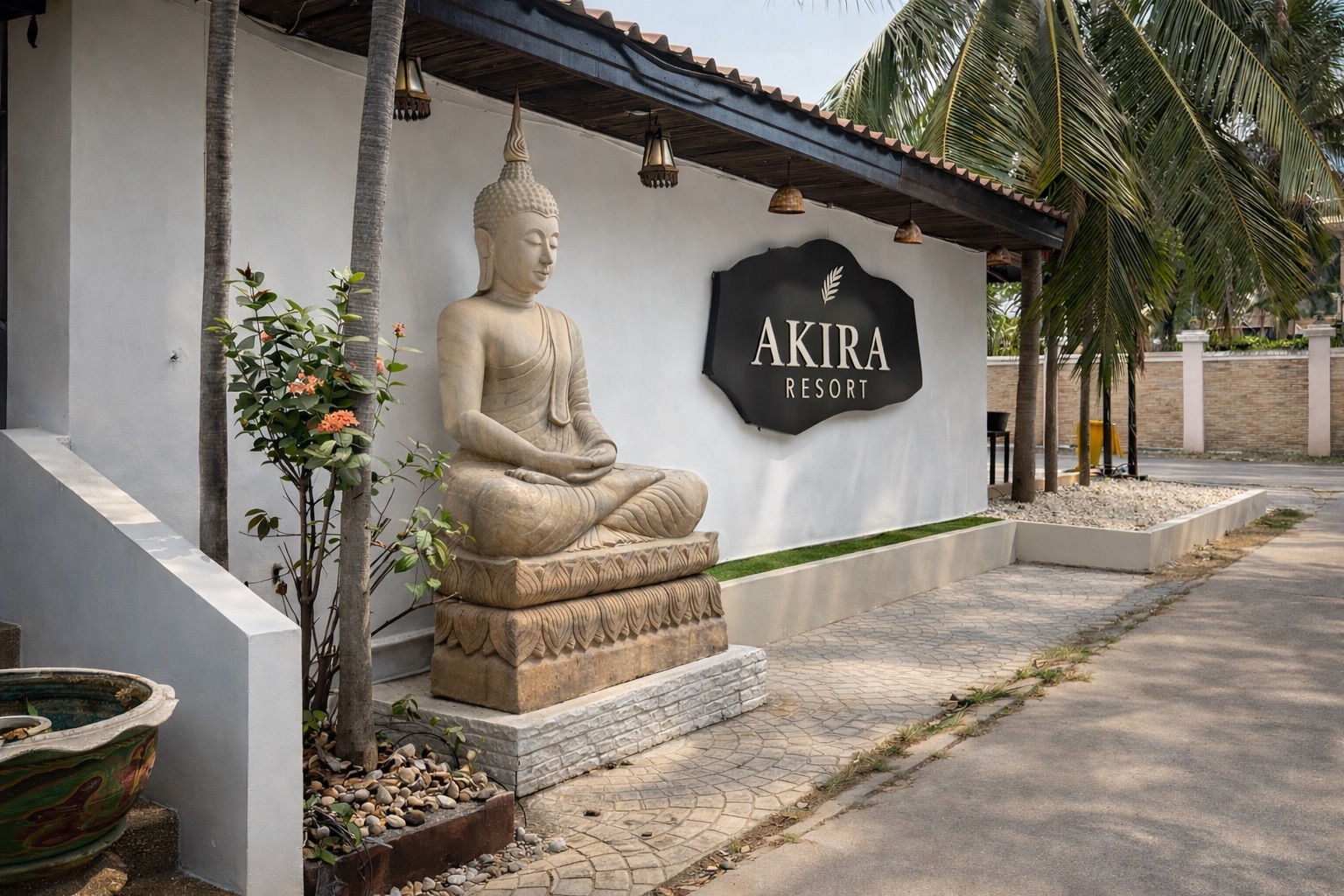 AKIRA Resort entrance with Buddha statue
